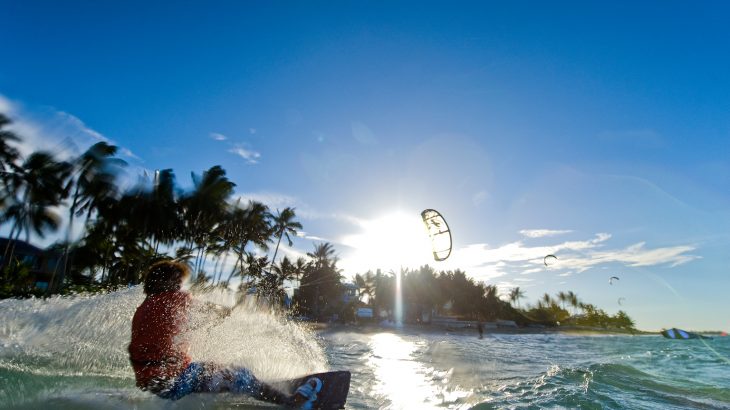 male-kite-surfer-turquoise-ocean-blue-sky