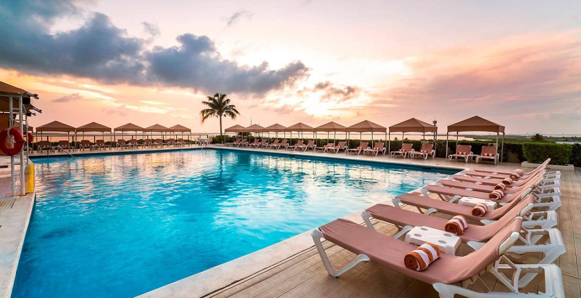 pool-umbrellas-loungers-sunset