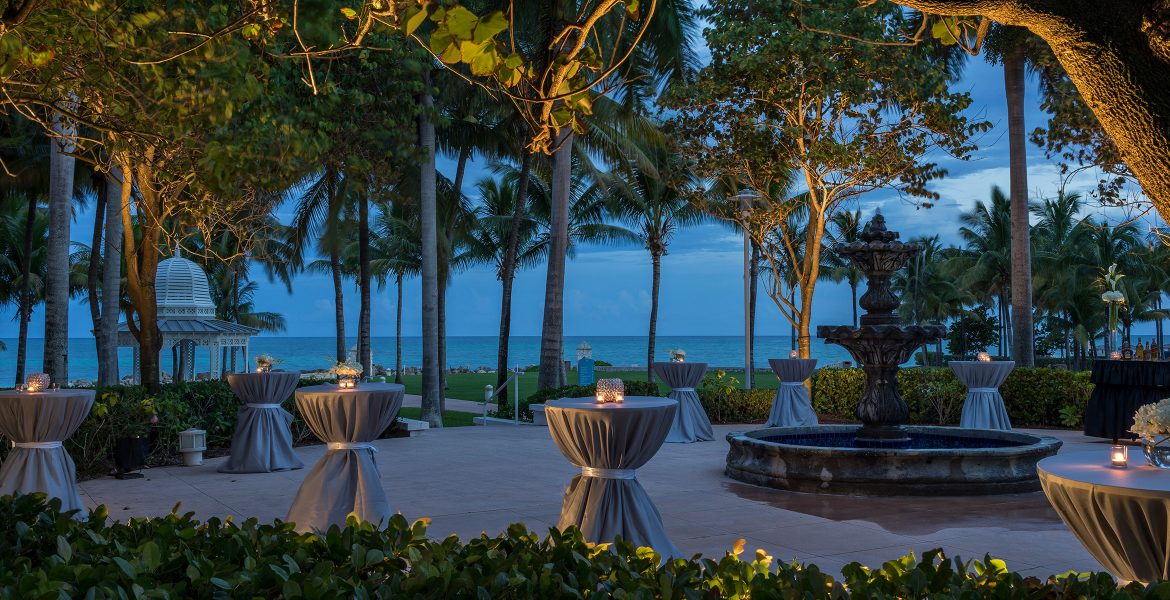 wedding-table-setup-by-beach-surrounded-by-palm-trees-dusk