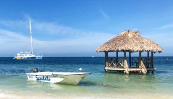 little-boat-in-water-hut-off-beach