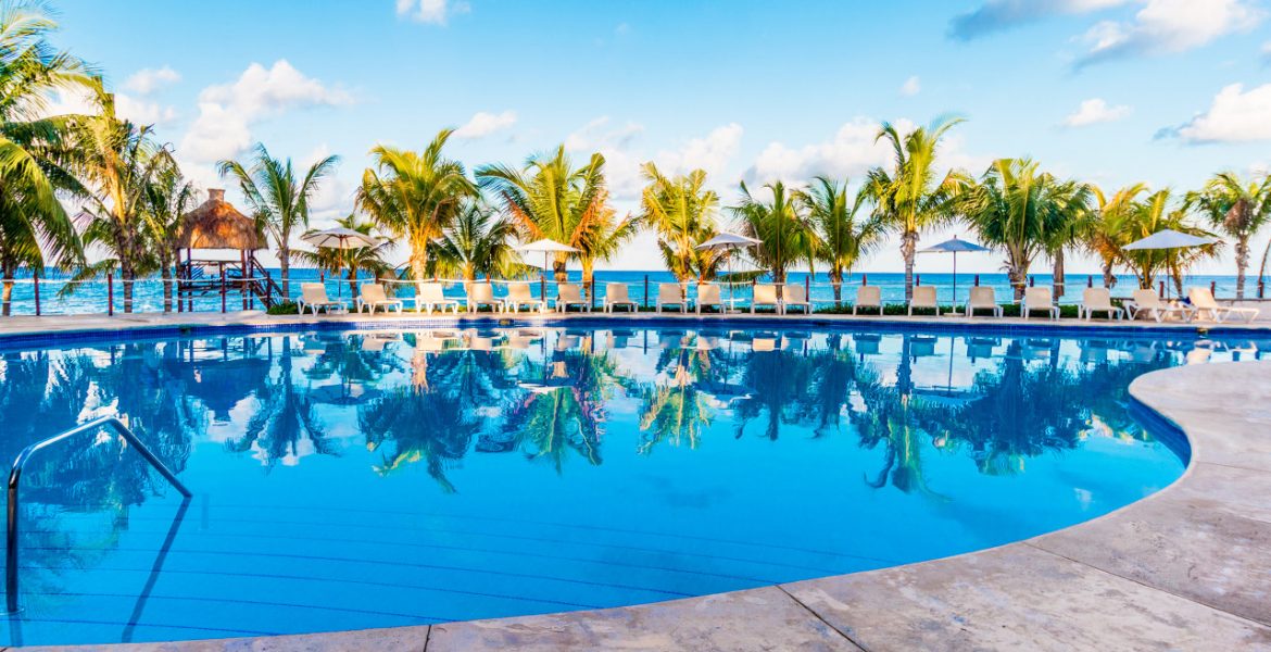 bright-blue-pool-green-palm-trees