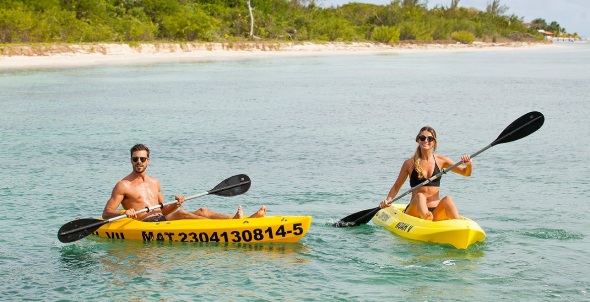 two-people-kayaking-yellow-kayaks