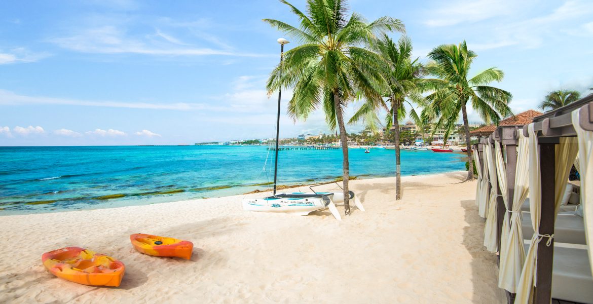 white-sand-beach-green-palm-trees-turquoise-water