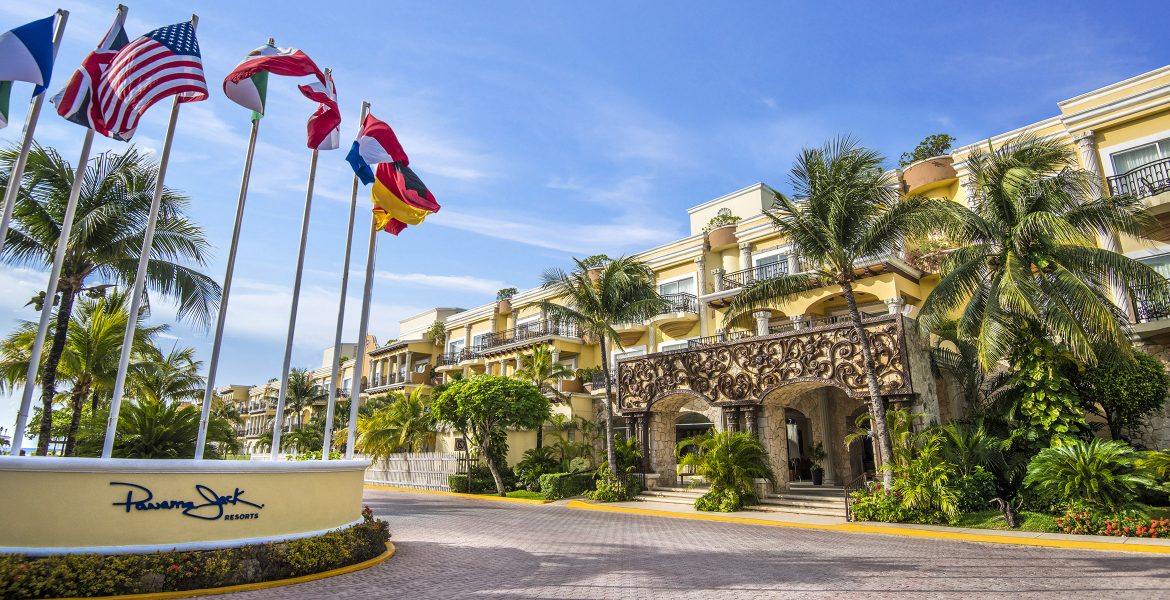 entrance-to-beach-resort-flags-blowing-in-wind