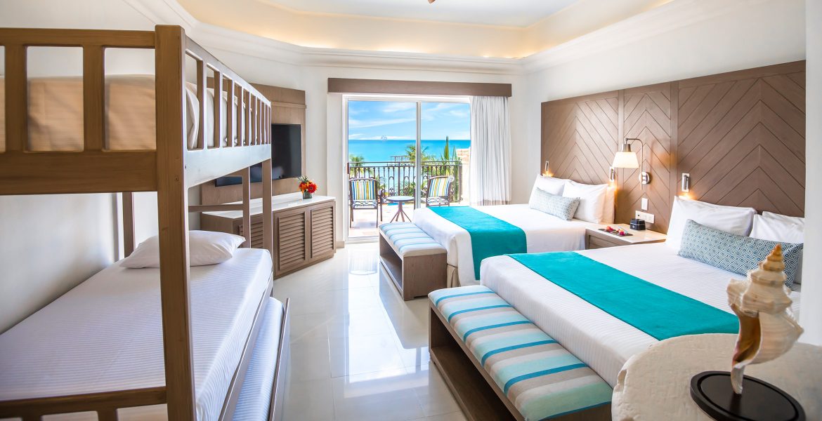 resort-suite-two-white-beds-turquoise-accent