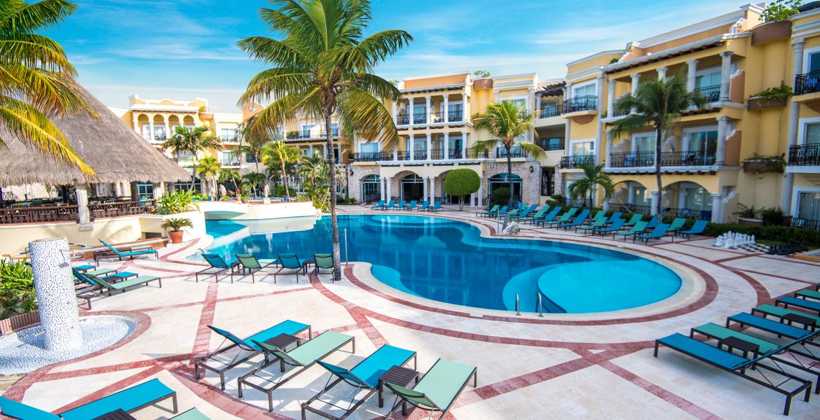 resort-pool-resort-building-green-palm-tree