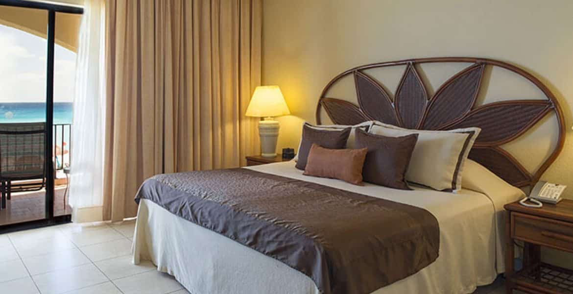 resort-suite-white-bed-brown-accents