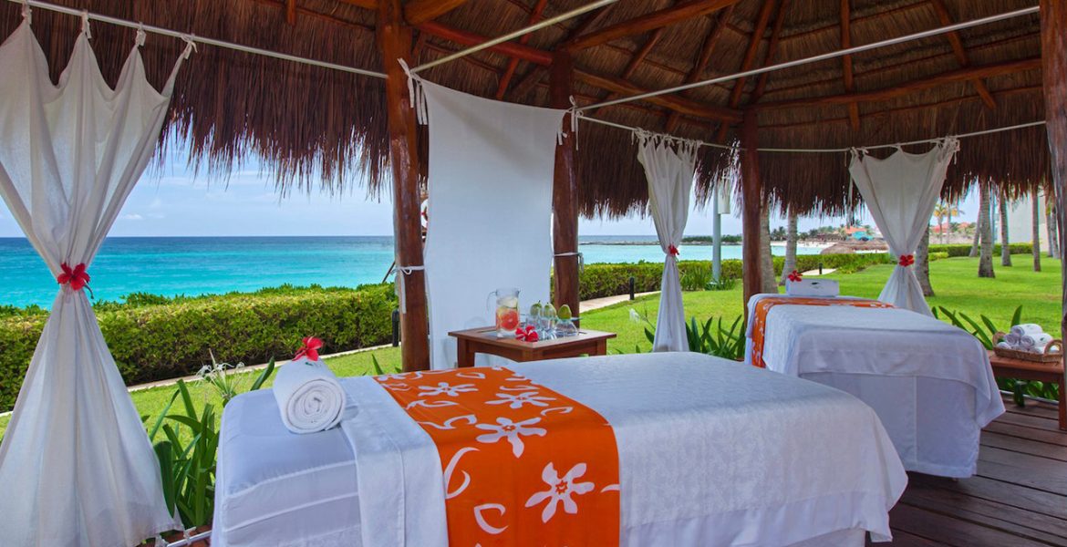 open-air-spa-by-beach-massage-table-orange-accent