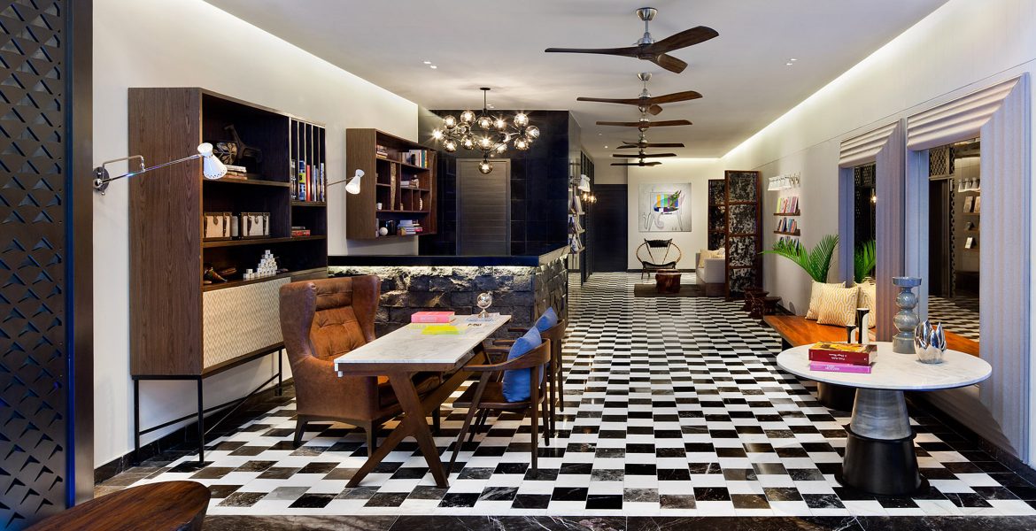 hotel-social-room-tables-books-checkered-tile-floor