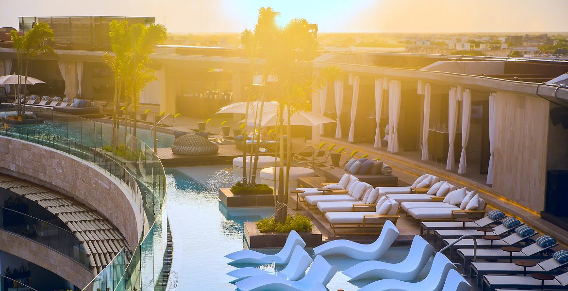 river-style-pool-with-white-loungers-sunset