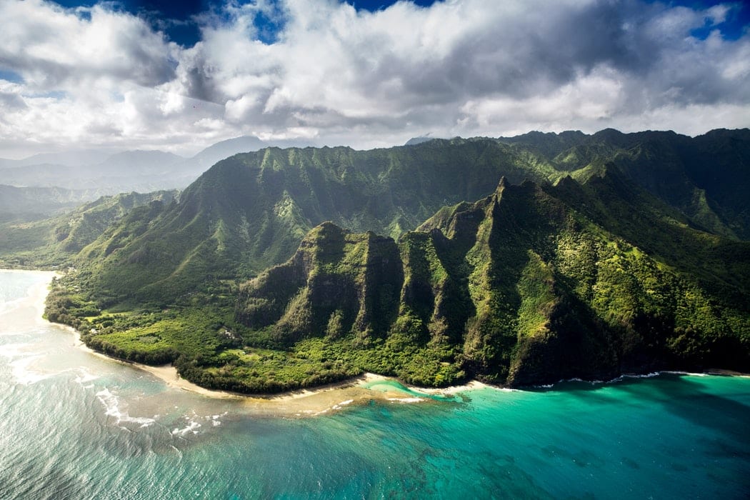 A mountain range by the beach in Hawai'i