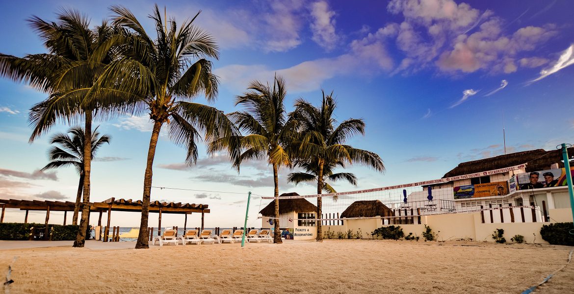 beach-hotel-volleyball-net-golden-sand-palm-trees