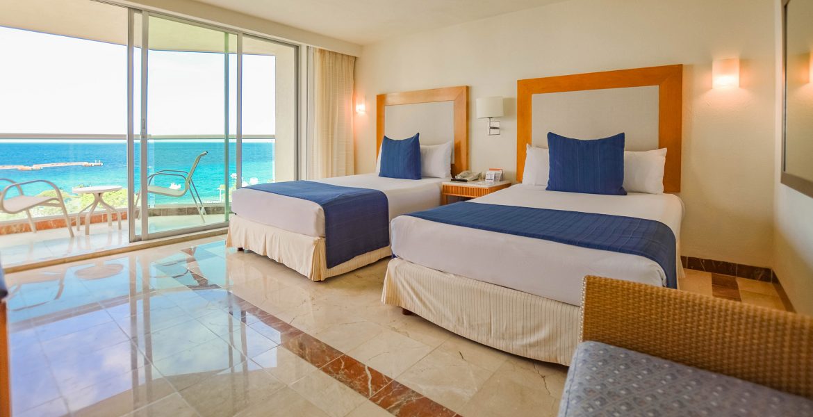 beach-hotel-room-white-beds-blue-accents