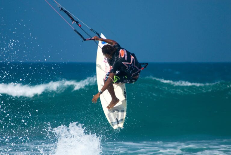 man-kitesurfing-getting-air-blue-ocean