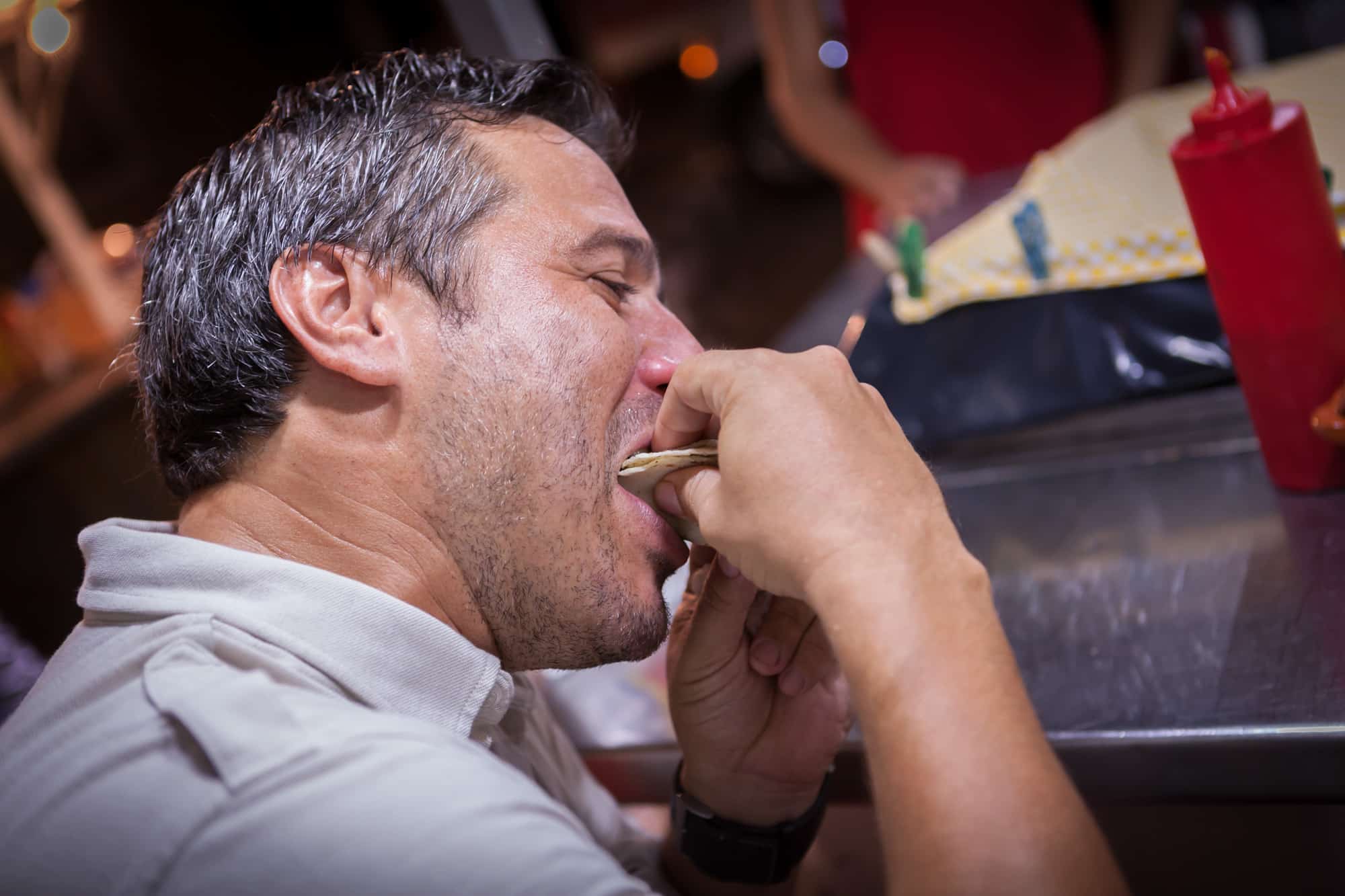 A man enjoying a bite of food on his Vallarta Food Tour