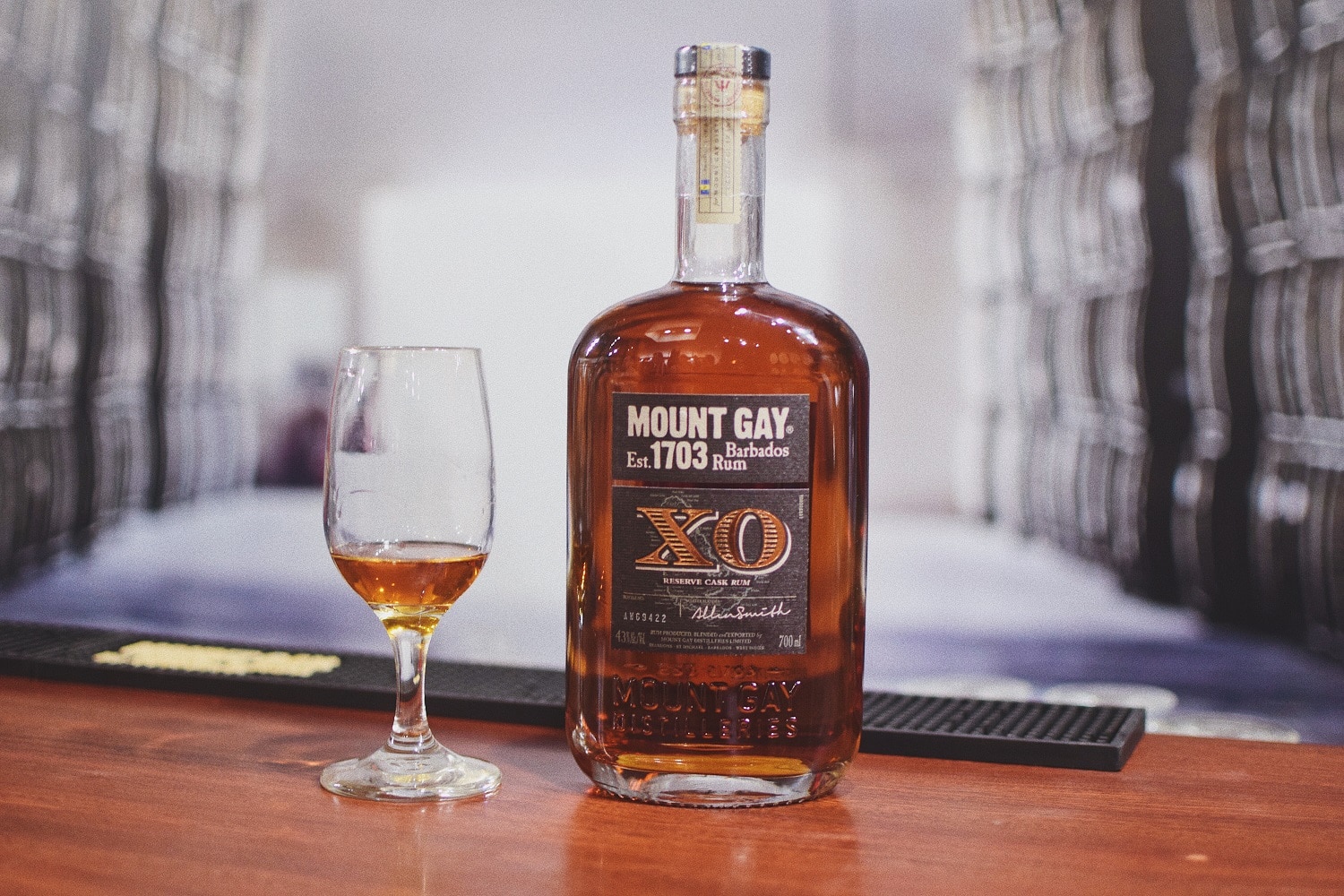 A bottle of Mount Gay XO rum and a tasting glass