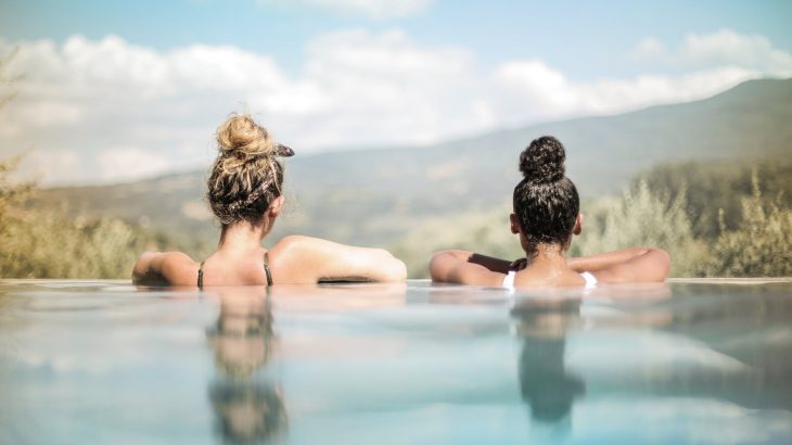 back-two-girls-in-infinity-pool