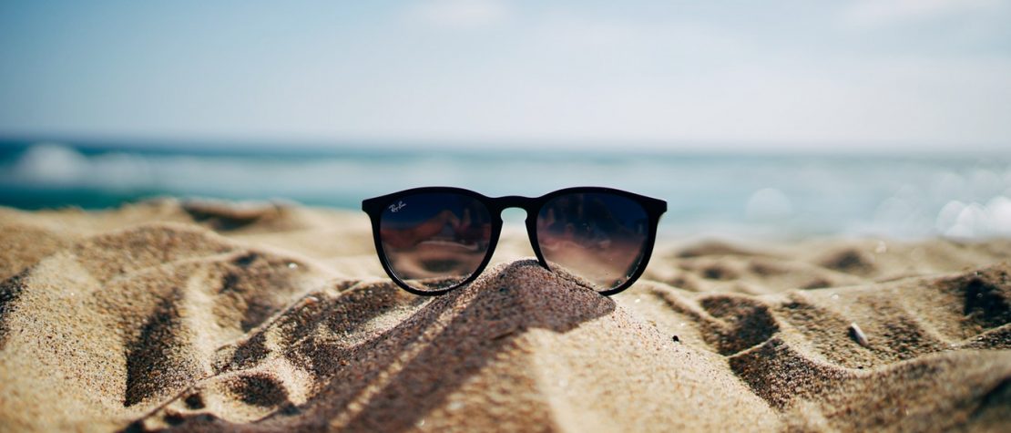 sunglasses-beach-sand-water