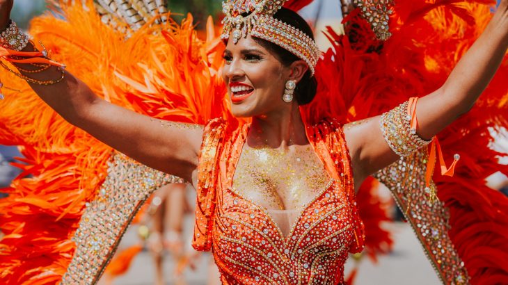 woman-orange-costume-sparkles-carnival-aruba