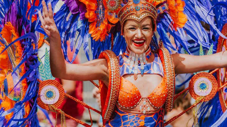 woman-wearing-orange-blue-carnival-costume-aruba