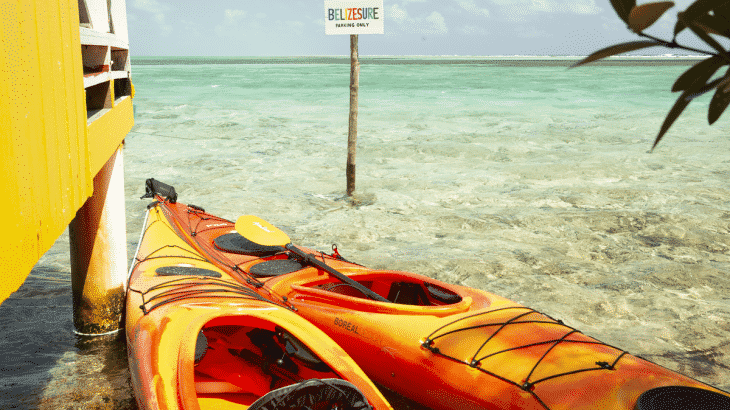 two kayaks outside of overwater yellow bungalow