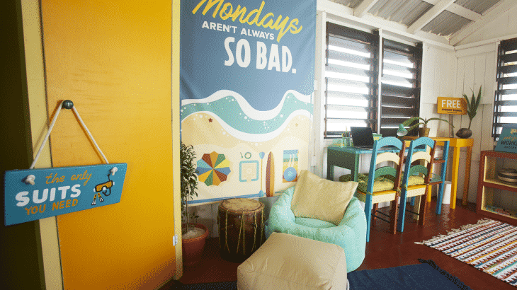 Chair inside office with funny beach signs