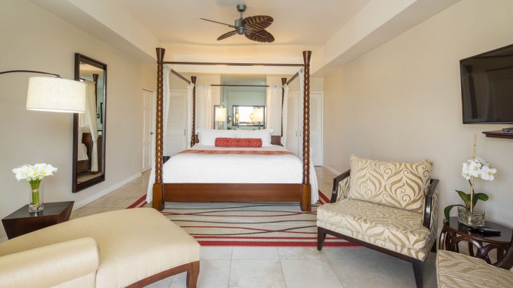 bedroom with four poster bed in big suite at Spice Island Beach Resort in Grenada