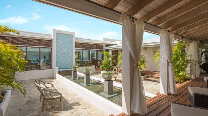 peaceful gardens with loungers and reflection pool part of the Janessa Spa at Spice Island Beach Resort