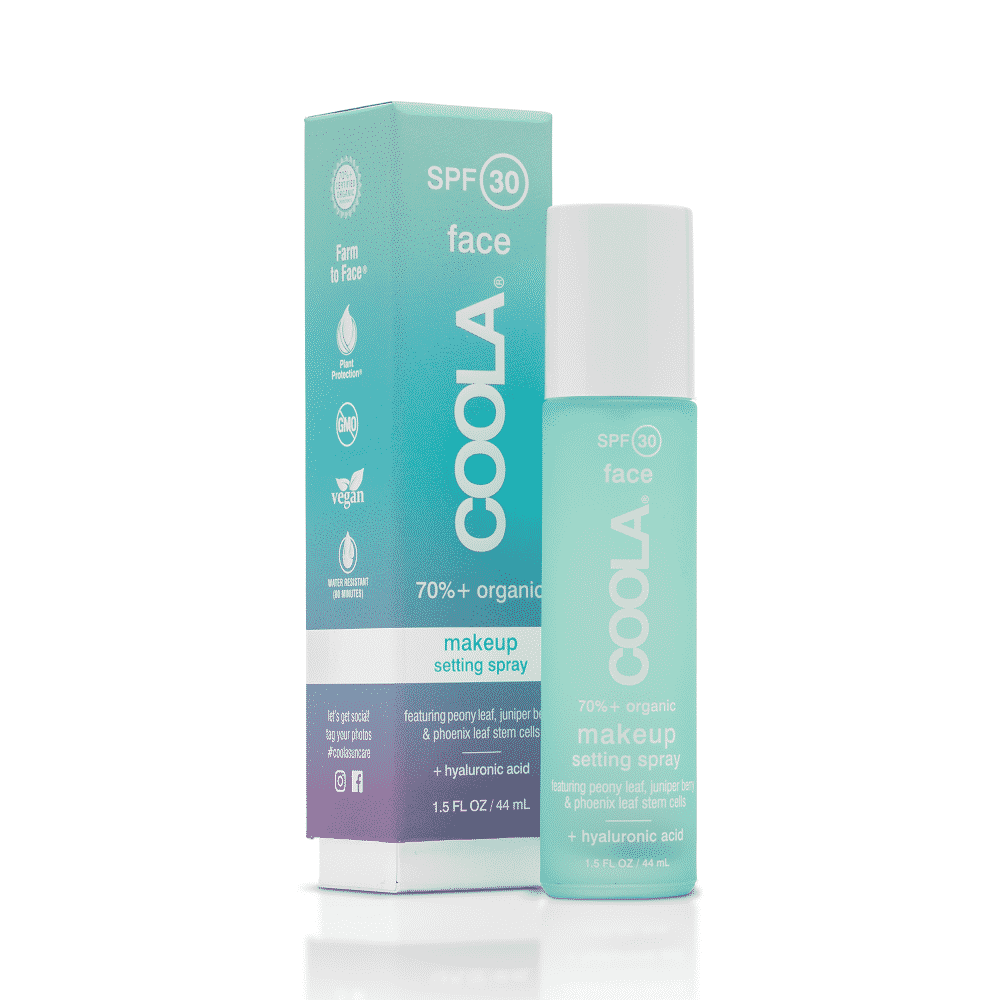 A bottle of Coola makeup setting spray with SPF