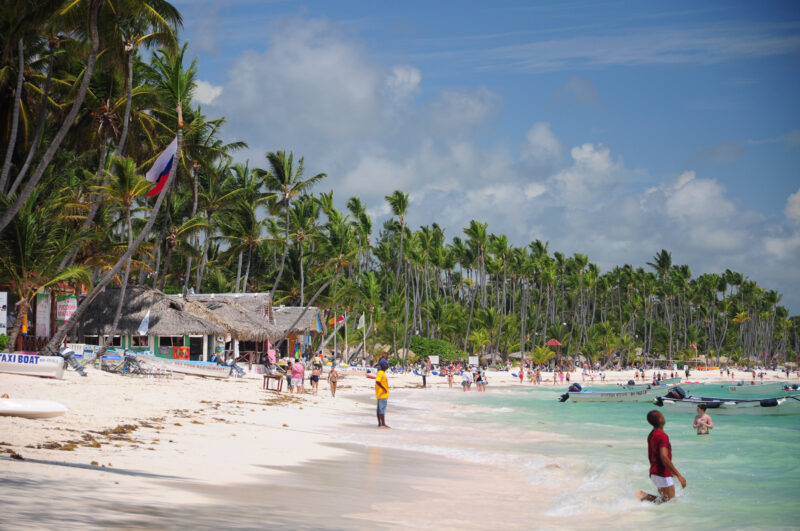 Punta Cana, La Altagracia, Domenican Republic. A vibrant beach scene in Punta Cana, Dominican Republic, with palm trees and clear waters.