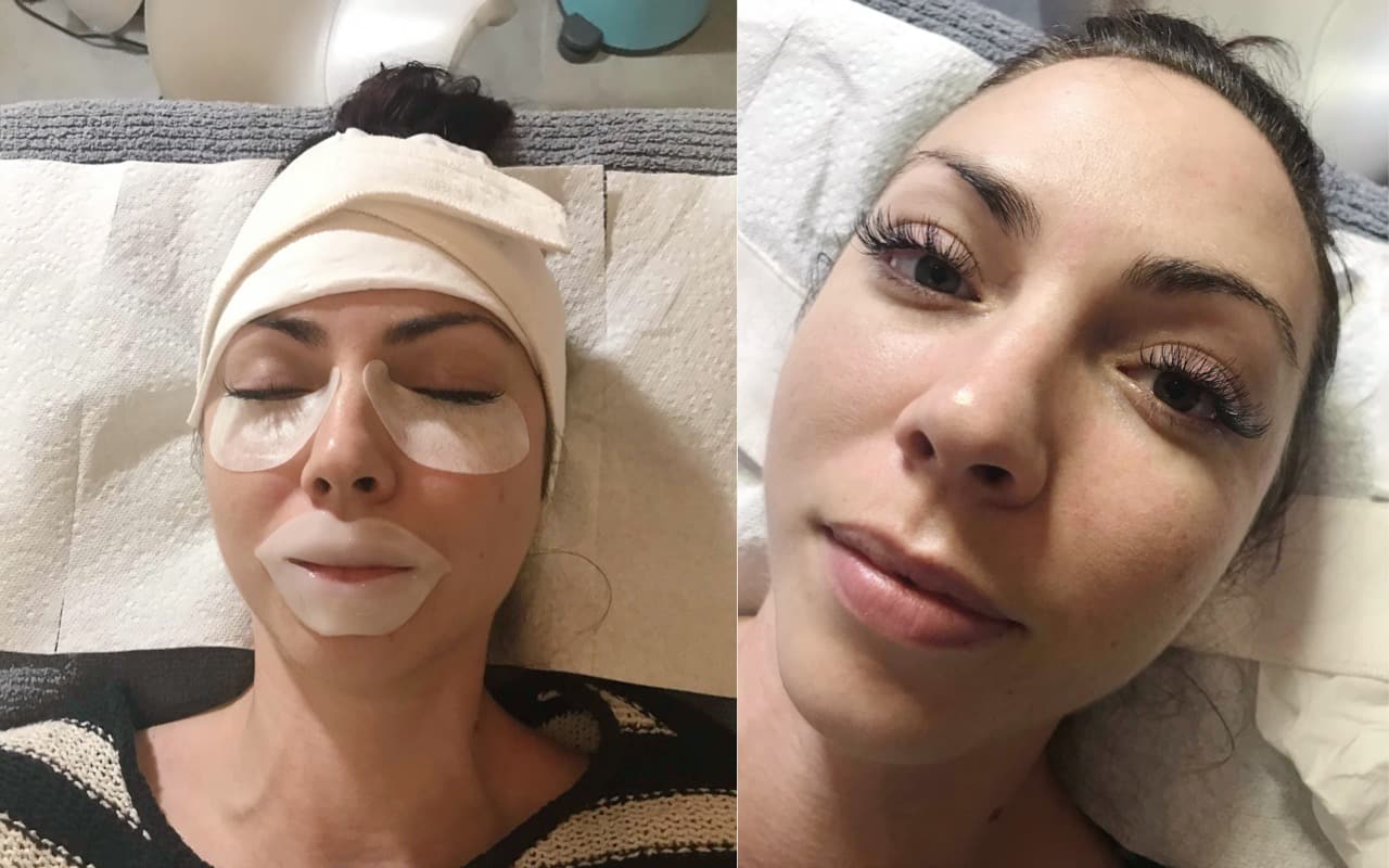 A woman lying on a spa treatment table receives eyelash extensions before her beach vacation