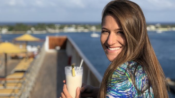 woman-holding-pina-colada-cruise-ship-florida-to-bahamas