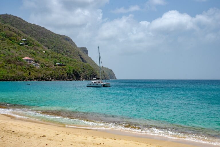 white-sand-beach-blue-water-boat