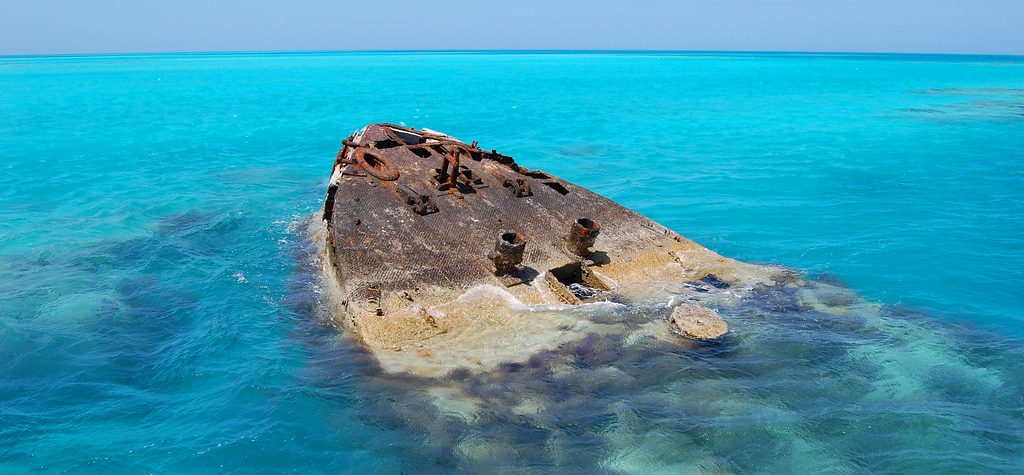 Tip of the Vixen shipwreck in the water in the Bermuda Triangle