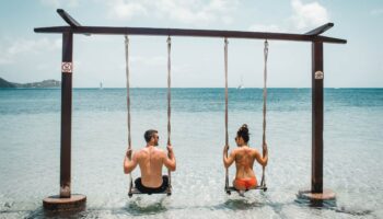 couple-overwater-swings-best-swimsuits-bachelorette-honeymoon