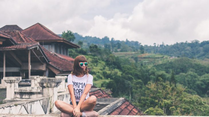 woman-traveler-sitting-on-rooftop