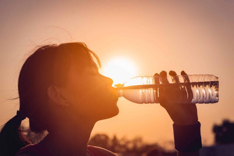 scary-facts-plastic-pollution-woman-drinking-bpa-water-bottle