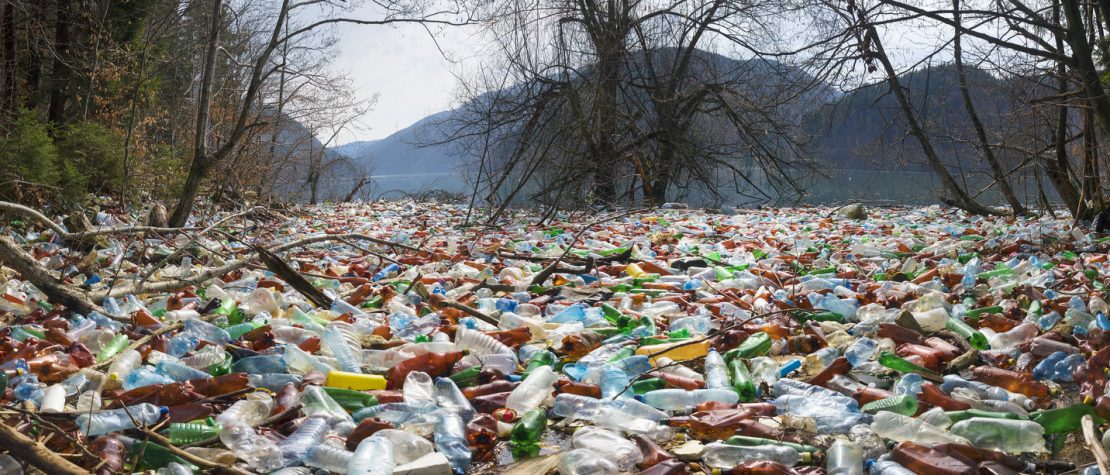 ground-covered-plastic-bottle-pollution-near-water