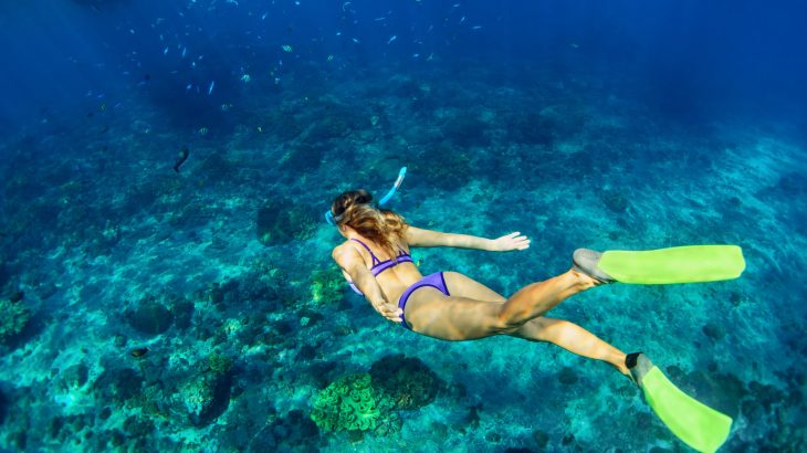 woman underwater snorkeling ocean travel captions for instagram