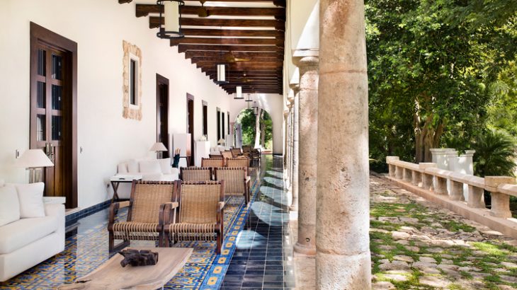 an-outside-patio-with-dark-wood-beams-and-original-Mexican-tile