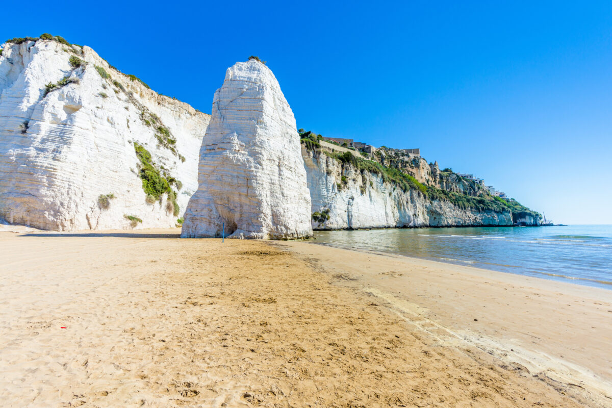 View of beach Pizzomunno rock, at Apulia, South Italy. Beach of Pizzomunno rock, at Vieste, in Apulia region, South Italy