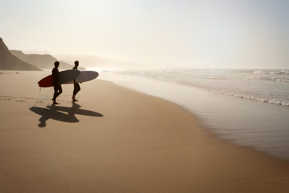 Surfer beach Praia do Lagido and island Baleal in summer, Peniche Portugal