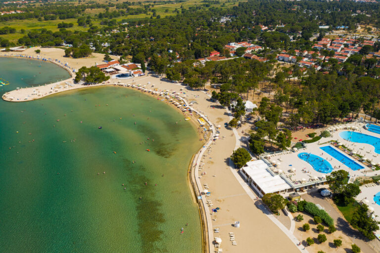 Aerial view of the beach with a swimming pool in Zaton, Croatia