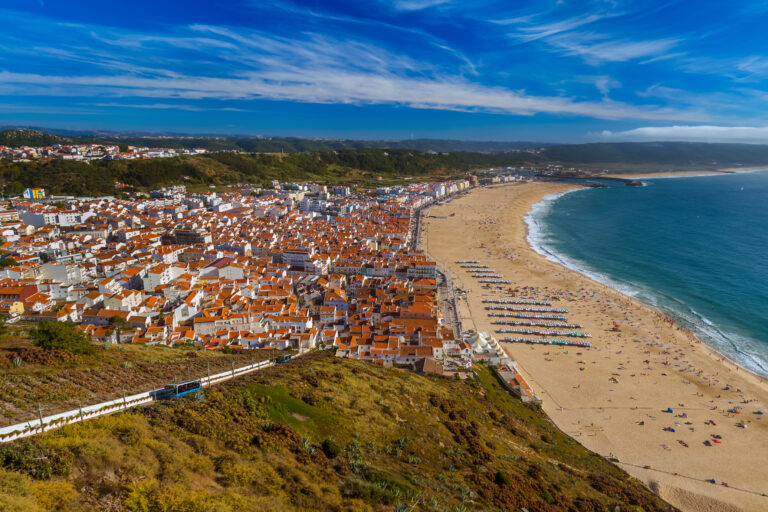 aerial of beach and city center of Nazare, Portugal