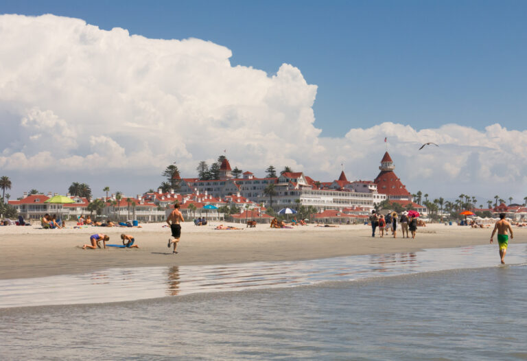 People walk on Coronado beach, San Diego, California, USA