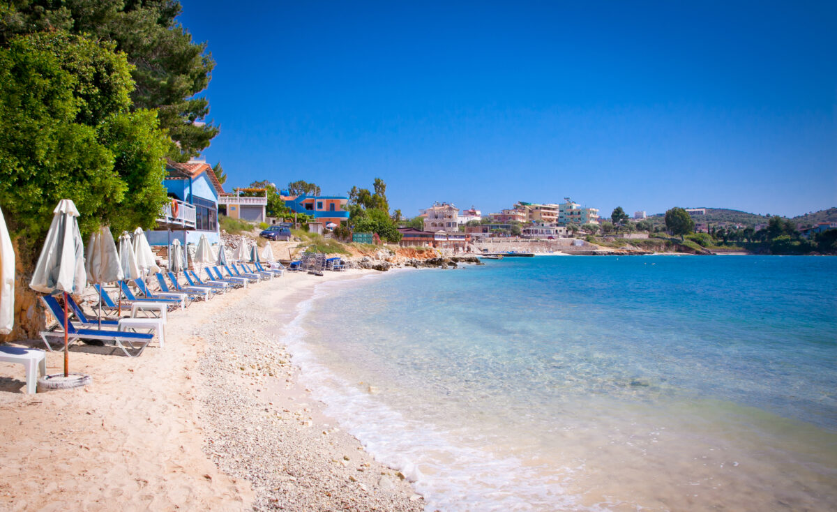 Sunshade umbrellas and deckchairs on the beautiful Ksamil beach, Albania.