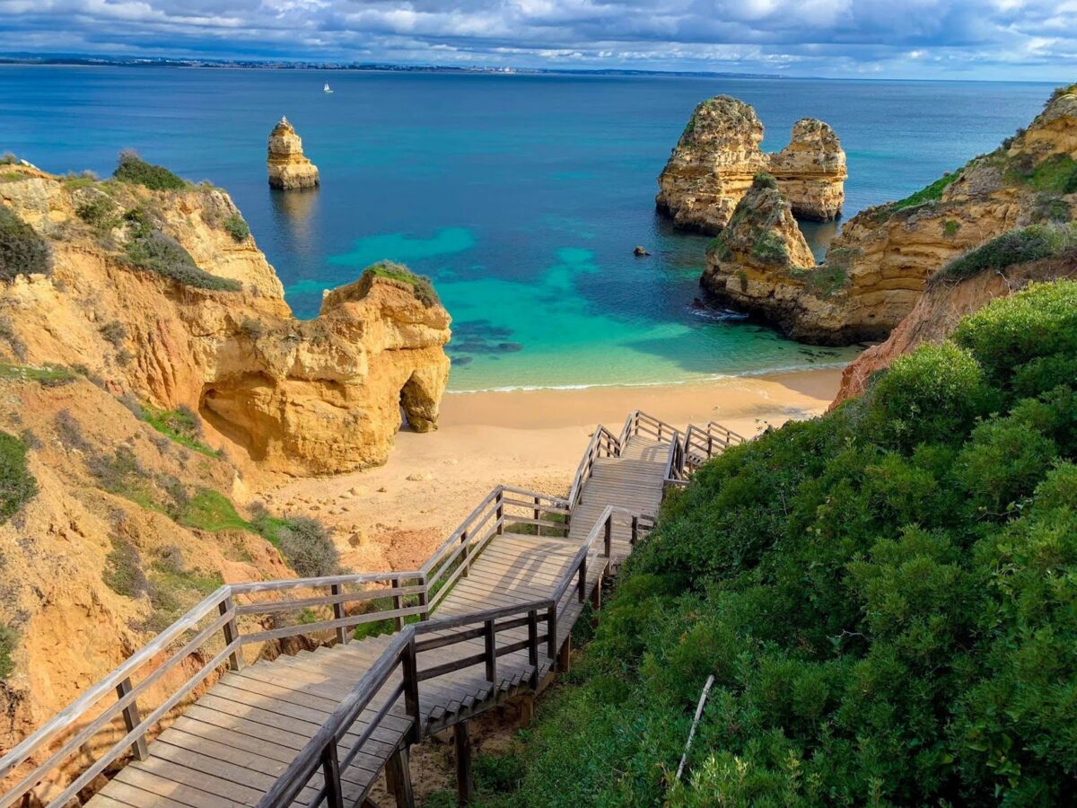 wooden staircase leading down to the beach in Lagos, Portugal