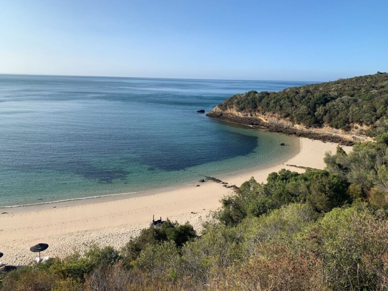 remote beach with blue skies in Setubal, Portugal