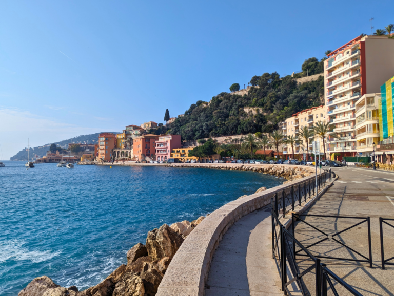 Walking path along the colorful houses and beach of Villefranche.