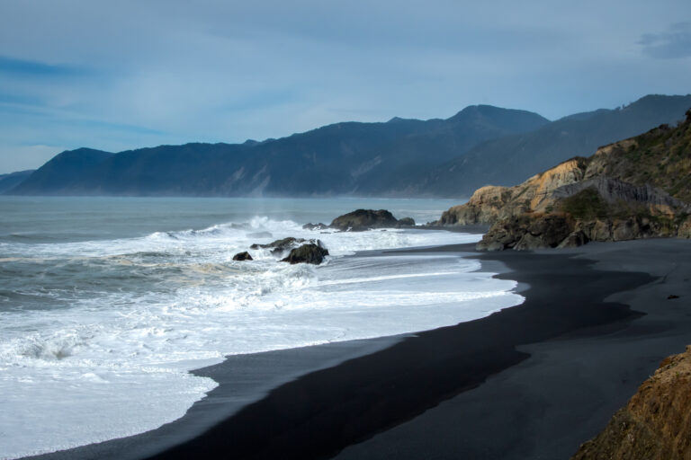 Wave rolling in on Blacksand beach at Shelter Cove, California